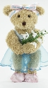 Photo of ballet teddy, Melody Bear, holding snowdrops